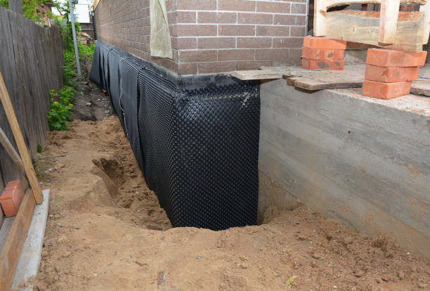 Happy homeowners after waterproofing job in Gastonia